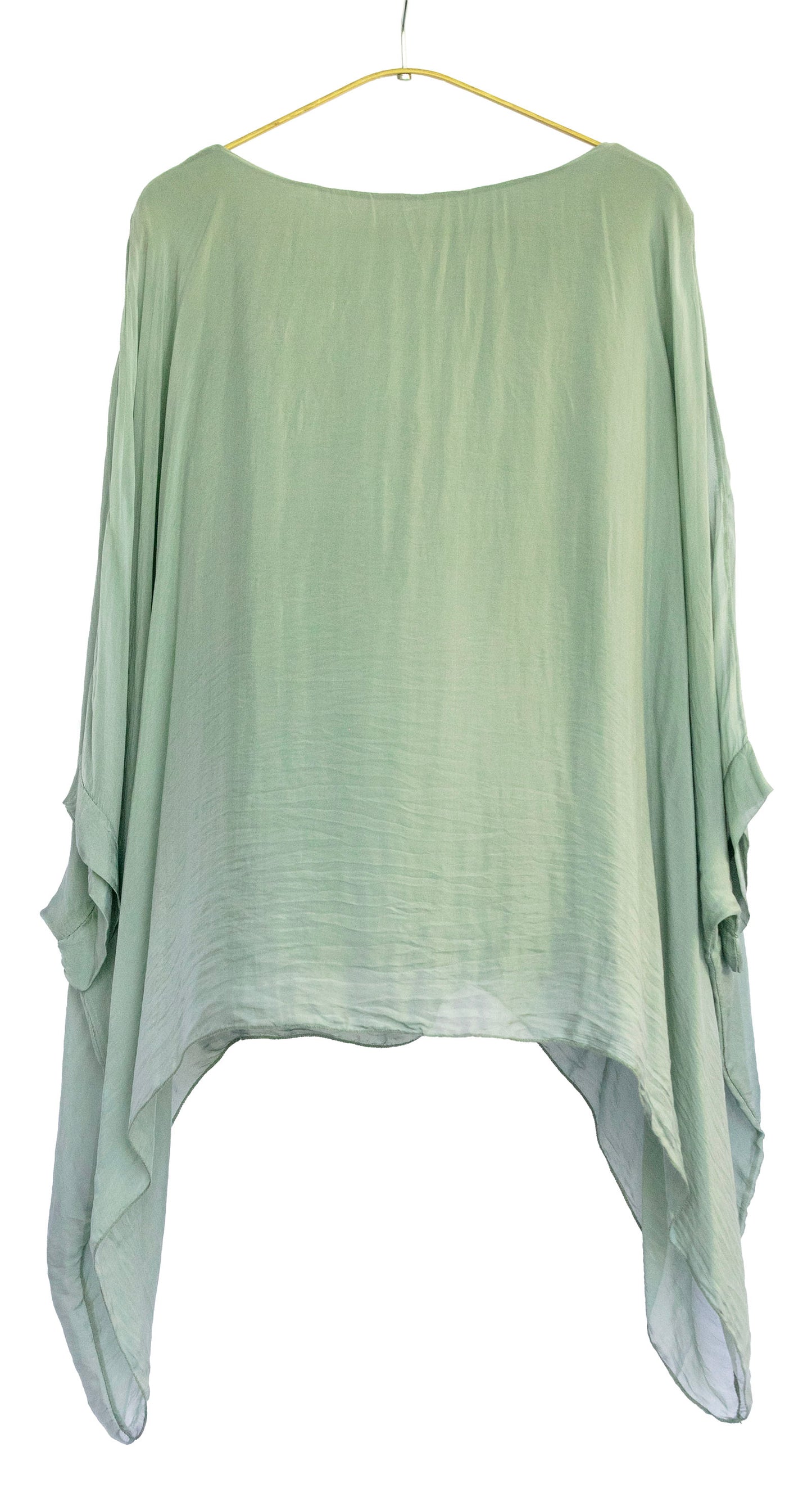 Light green bat wing silk top on a hanger against a white background